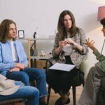 woman discussing problem during group therapy